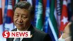 Beijing says no threats in Xi-Trudeau confrontation video