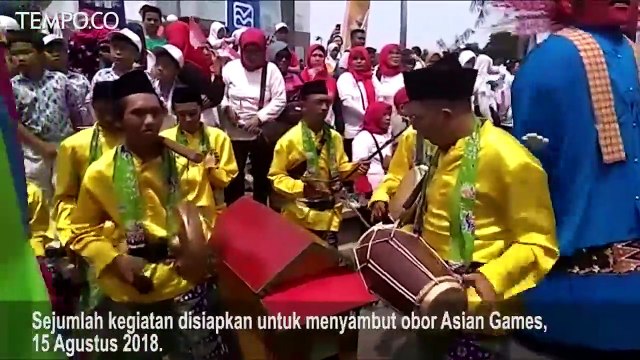 Warga Antusias Sambut Obor Asian Games