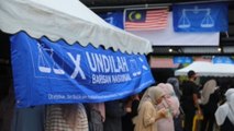 Malasia acude a las urnas en comicios que buscan poner fin a crisis política