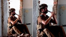 Ukrainian soldier plays haunting music inside ruins of bombed-out building