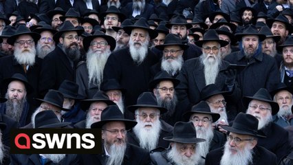 Thousands of Hasidic rabbis clad for a 'class picture' to mark the end of an international conference