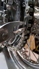 mechanic was shifting motorcycle chain