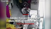 Video Viral Suami Istri Asyik Main Ponsel di Kasur, Balita Manjat-manjat Sepeda Motor