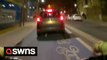 Shocking moment driver mounts busy cycle lane as multiple cyclists narrowly avoid collision during London rush hour