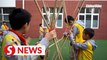 Colorful activities enrich children's lives at Chinese schools