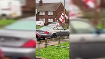England fan bangs out Three Lions draped in St George's flags as World Cup fever hits