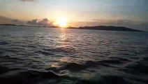 the beautiful panorama of the sunset seen from the middle of the sea