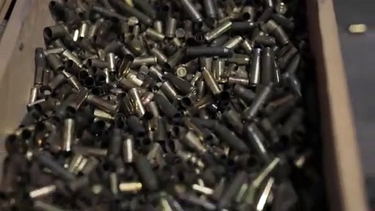 Empty_Bullet_Shells_in_a_Wooden_Container(360p)
