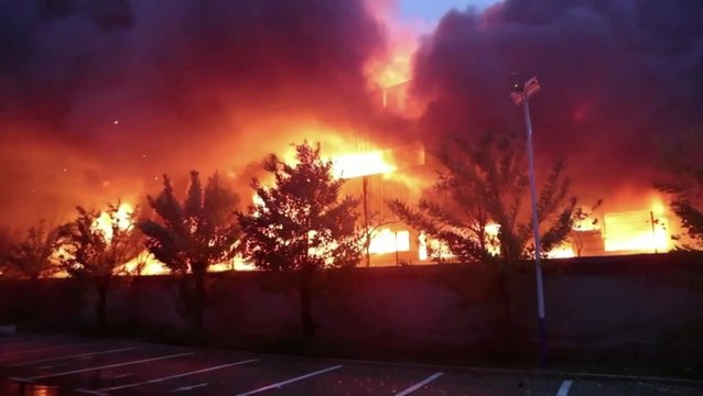 Thick smoke billows into air as deadly blaze engulfs factory in central China