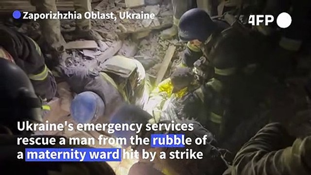 Ukrainian emergency services rescue man from rubble of shelled maternity ward