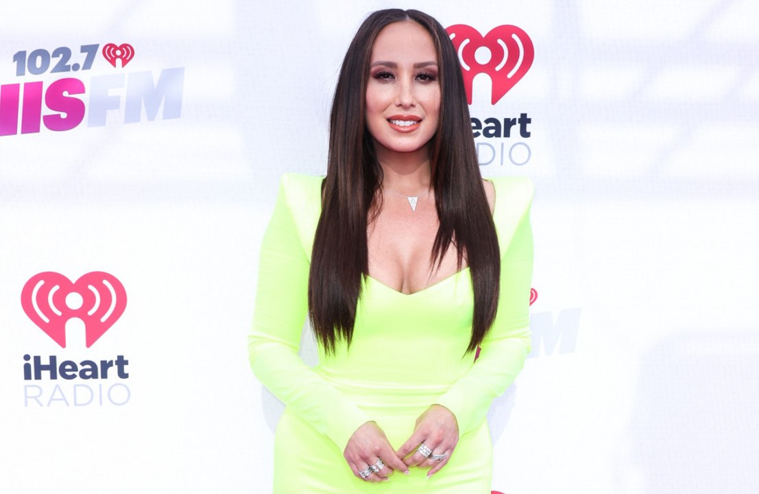 Cheryl Burke says she would return to DWTS as a...