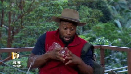 Babatunde Aleshe excitedly spills champagne over himself as he leaves I’m a Celeb
