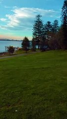 Uber chill drone view video of a sculpture over the beach during a sunset in Sydney Australia.