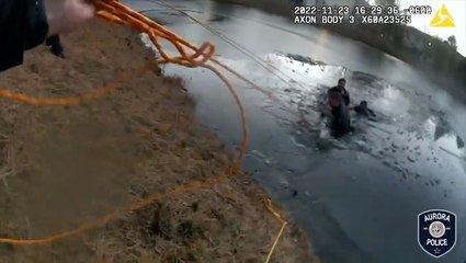 Police officers rescue a mother and her child from an icy Illinois pond