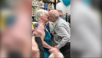 Sweet elderly couple get married in supermarket condiment aisle where they first met
