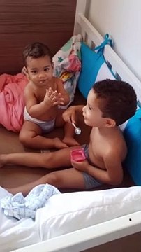 Boy Caught Giving Yogurt to His Little Brother