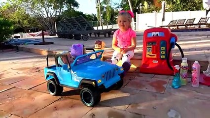 Diana pretend play with new cars .