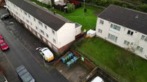 Three people have been arrested after the discovery of two dead babies at a property in South Wales