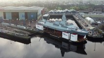 Views of Type 26 frigate HMS Glasgow on barge on the banks of the River Clyde