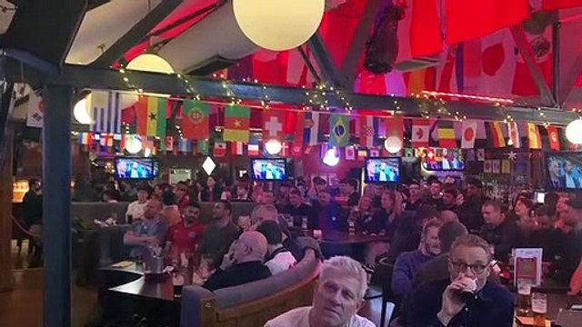 England fans at The Common Room sing the National Anthem ahead of the World Cup game against Wales