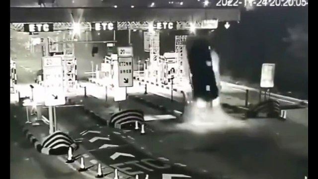 Shocking moment car slams into a motorway toll station sending vehicle flying 50ft into the air with the driver somehow surviving crash in China
