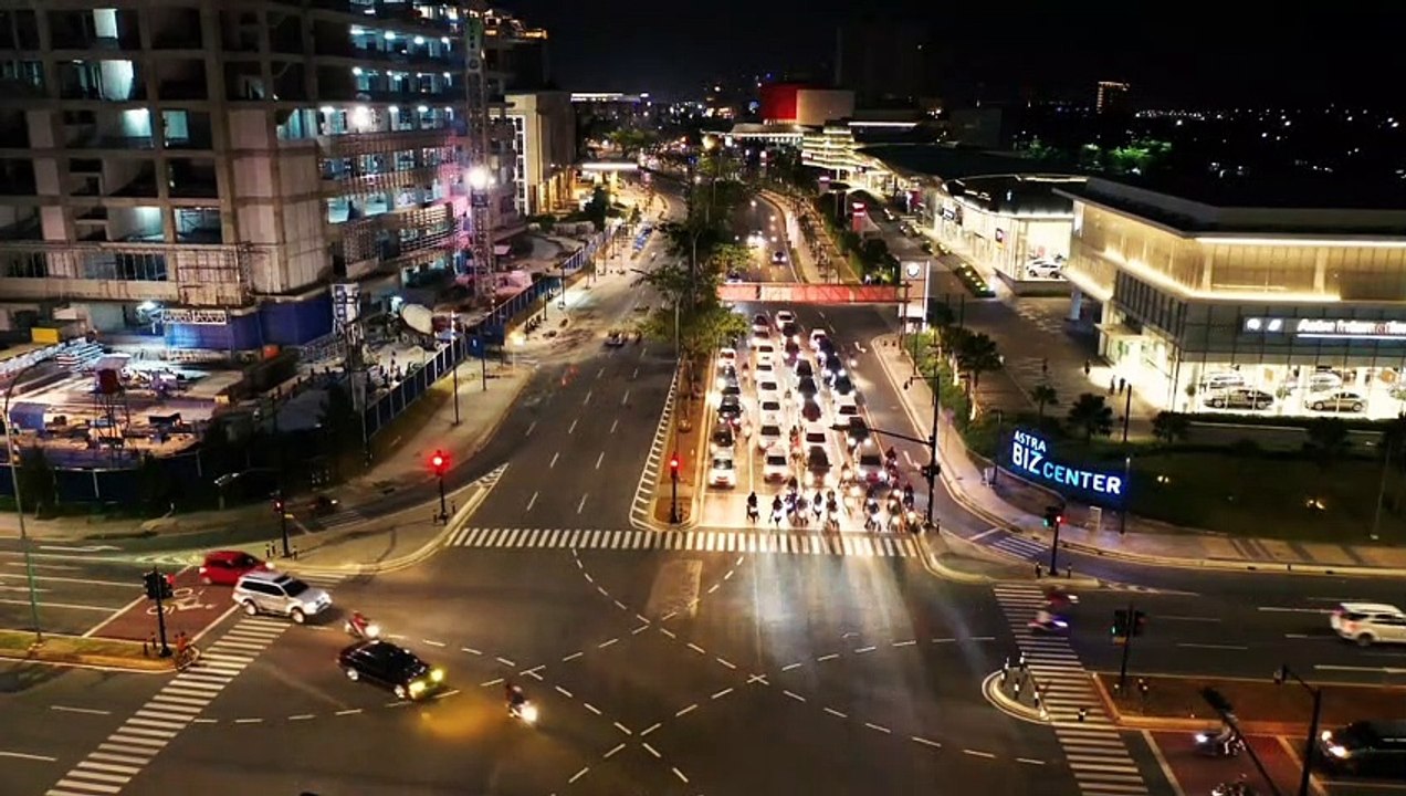 Aerial Footage Of Vehicular Traffic From A Road Intersection At Night