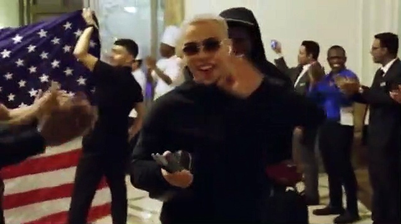 USA stars are celebrated as they arrive back at their team hotel in Qatar after advancing to World Cup last-16... and hurt Christian Pulisic is there to congratulate teammates following trip to hospital