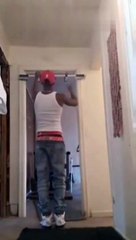 Guy Working out with Door Pull-Up Bar Hits the Ground