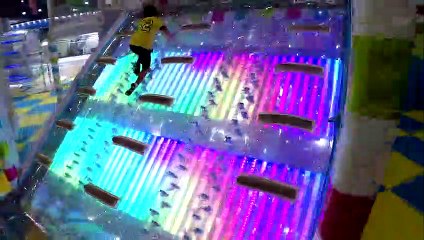 Roma and Diana play and jump on trampolines