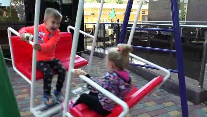 Roma and Diana play on the outdoor playground near the house