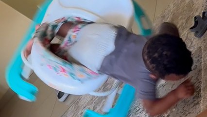 Mischievous toddler does a SCORPION after falling out of his walker