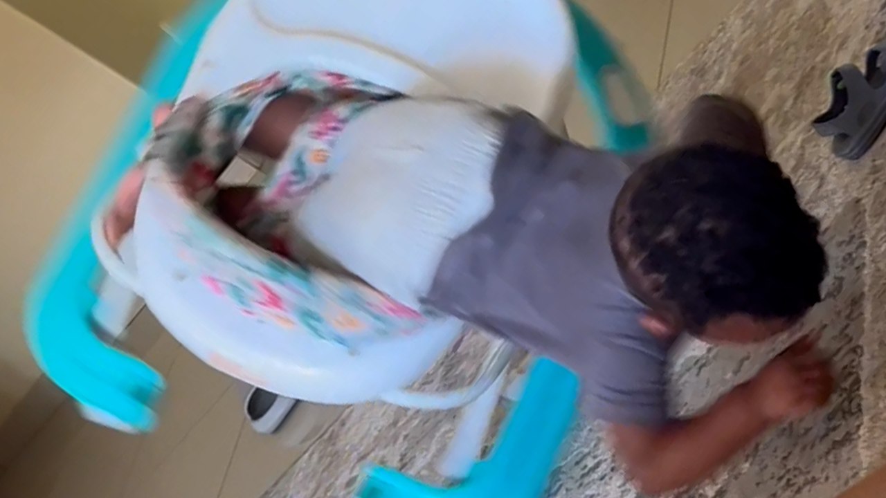 Mischievous toddler does a SCORPION after falling out of his walker