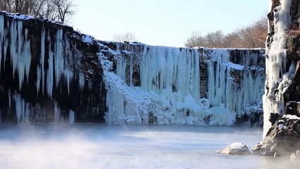 Stunning winter scenes take over China’s Jingpo lake as 130ft Diaoshuilou Waterfall freezes