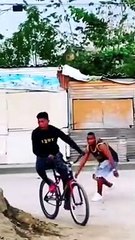 A prank causes the biker to fall