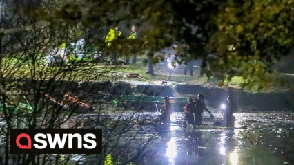 Rescue teams searching freezing lake for survivors after a number of people 'fell through while playing on ice' and are in a critical condition