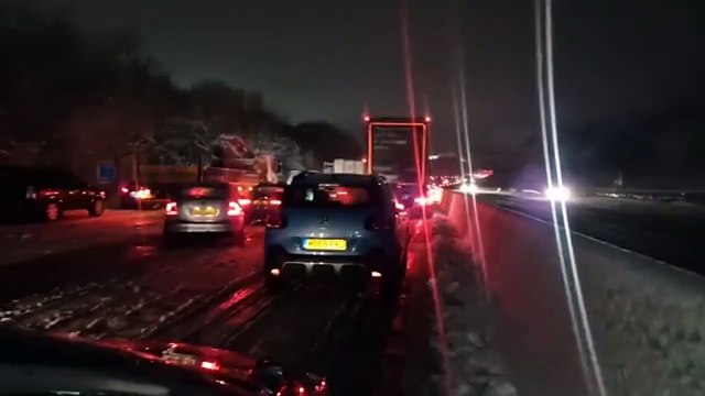 Motorists were left stuck in their cars overnight on the M25 after snow brought traffic to a halt