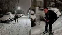 Londoner skis down snow-covered road as cold snap hits capital