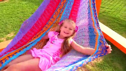Diana and Dad play at the playground