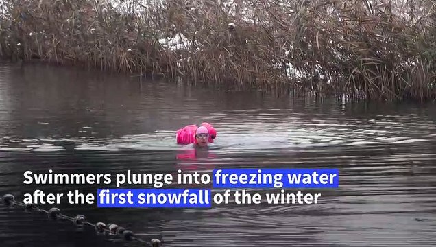 Outdoor swimmers brave near-freezing water as snow hits London