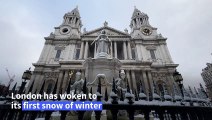 London coated in first snow of winter after cold snap