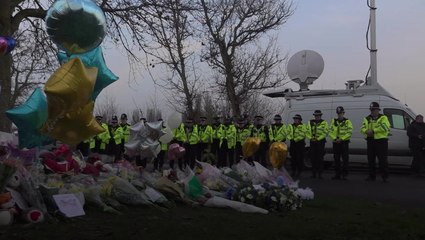 Tearful police pay silent tribute to boys who died in ice-covered lake tragedy