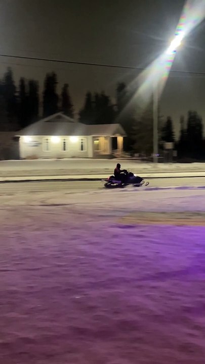 Police Appear to Pursue Snowmobiler