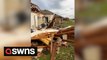 Single mother left homeless after two-bedroom house levelled by tornado while she hid in bathtub with two children