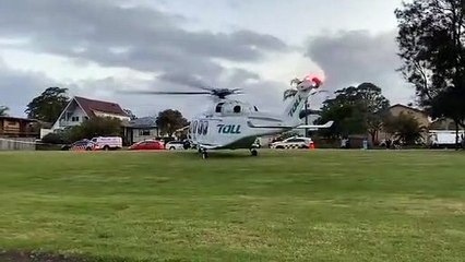 Toll rescue helicopter lands in Bellambi on Sunday night. Video by Darren Malone.