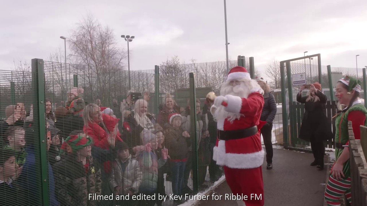 Father Christmas arrives by helicopter at Barden Junior School Burnley