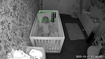 Little girl attempts to climb out of crib then falls out (Security camera)
