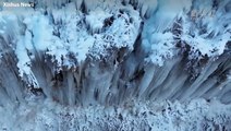 Enormous icicles create winter wonderland along valley in China