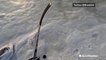 Showing off hockey skills over frozen ocean waters