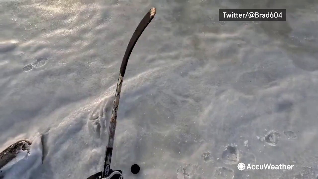 Showing off hockey skills over frozen ocean waters