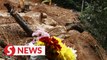 Floral tributes left at site of Batang Kali landslide
